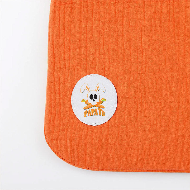 Vendbar økologisk hagesmæk i bomuld – blød frotté og musselin, fremstillet i Frankrig