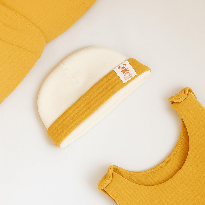 Babyhue i økologisk bomuldsfleece – blød og varm hue til nyfødte, fremstillet i Frankrig